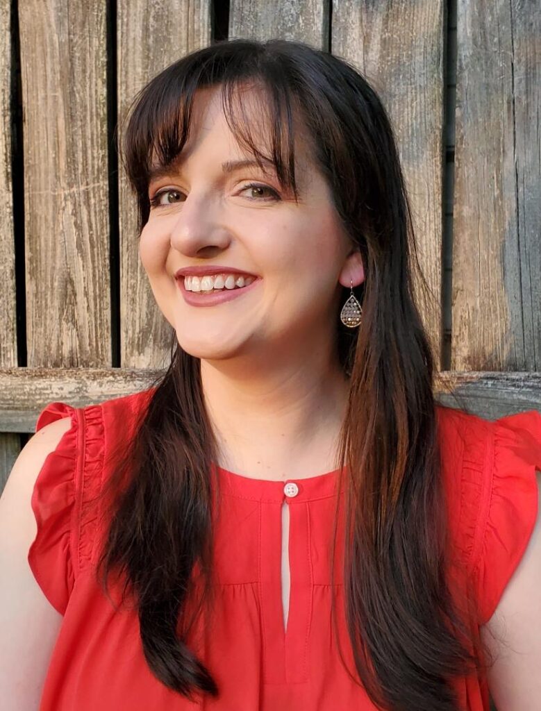 Ashley Bond, brunette woman in a red blouse