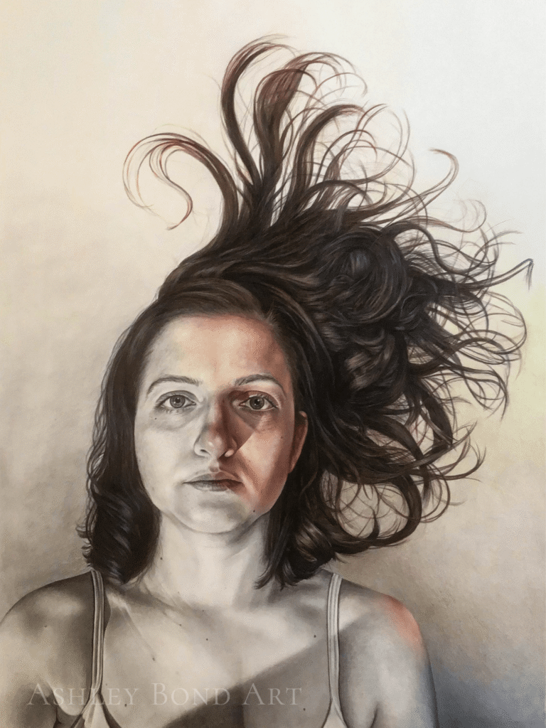 Colored pencil and graphite self portrait of the artist. Grayscale image fades into color.